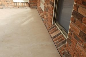 light travertine porcelain pavers paved around balcony of a house